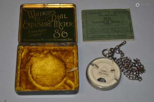A Watkins Dial Exposure Meter, with focus chain, condition F, a mark on edge of front glass,