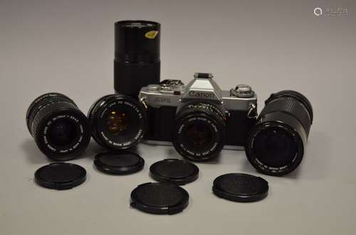 A Canon AV-1 SLR Camera and Canon Lenses, including AV-1 serial no 1513804 with FD 50mm f/1.8