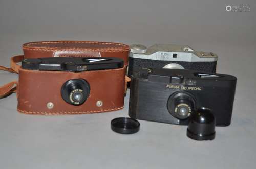 Three Purma Roll Film Cameras, two Purma Special Bakelite cameras, one with back taped on in maker's