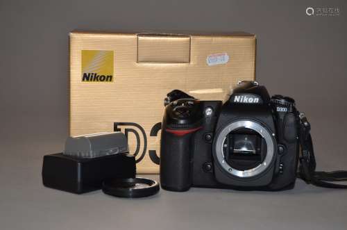 A Nikon D300 DSLR body, serial no 8015266, shutter working, with charger, 2 batteries, instructions,