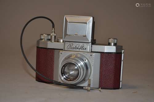 A Praktiflex 35mm SLR Camera serial no 2681, chrome body red leather, circa 1940 version without