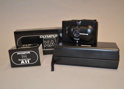 An Olympus XA Camera, condition G, some rubbing on back, with an A11 electronic flash, maker's