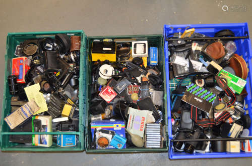 A Large Quantity of Photographic Accessories, including flash brackets, flash guns,