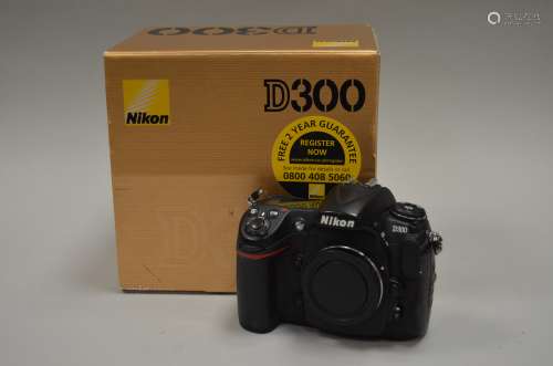 A Nikon D300 DSLR body, serial no 8034834, shutter working, with charger, battery, instructions,