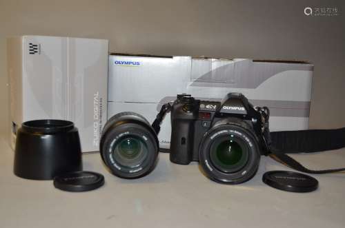 An Olympus E-1 Four-Thirds DSLR Camera, and Zuiko Lenses serial no 500009699, battery present, no