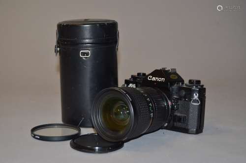 A Canon A1 SLR Camera, serial no 1508456, untested, with finger grip cover and a Canon FD 28-85mm