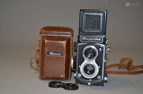 A Ricoh Dia Roll Film TLR Camera, serial no 33975, body E, Rikenon 8 cm f/3.5 lens, G, some light