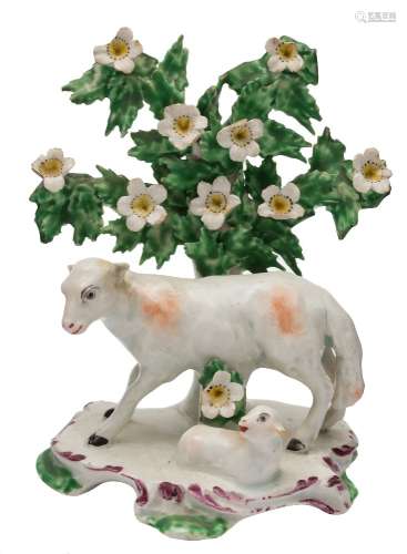 A Bow group of a ewe and lamb: with floral bocage support and on flat base edged with puce scrolls,