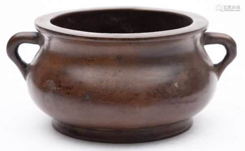 A Chinese bronze censer: of compressed circular form with flat rim and loop handles,