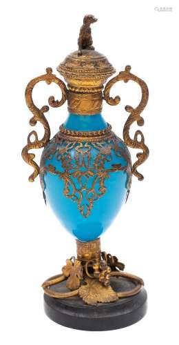 A Continental blue glass and gilt-metal mounted scent bottle: with seated dog finial,
