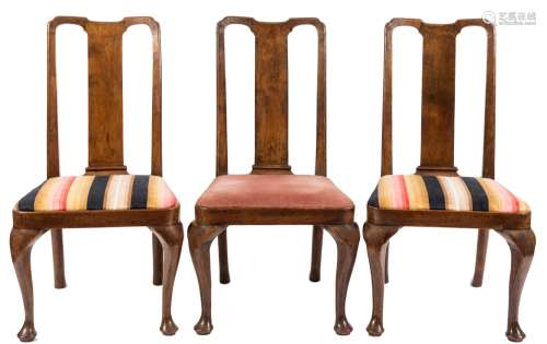 A walnut veneer extending dining table and set of twelve dining chairs in the George I taste:,