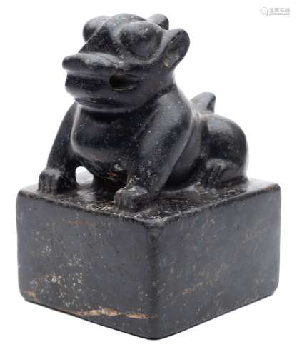 A large Chinese black hardstone seal: carved with a seated mythological beast and four-character