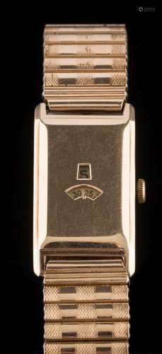 A gentleman's 9ct gold cased duo-dial, rectangular wristwatch: with concealed hour and second dials,