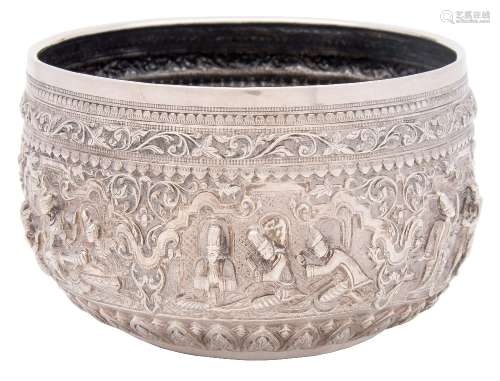 A Burmese silver rice bowl: with embossed decoration depicting scenes from a king's palace with