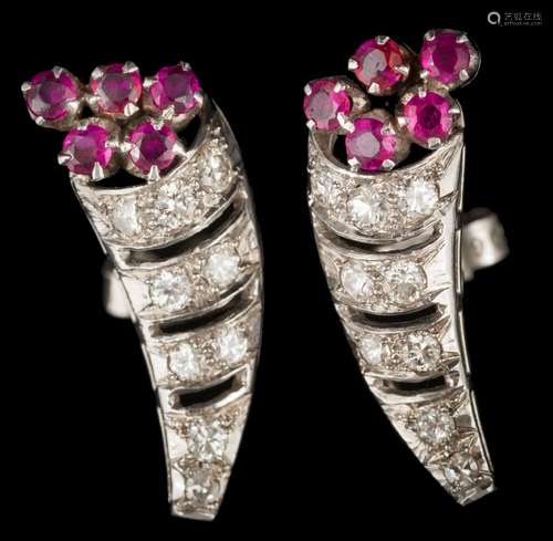 A pair of ruby and diamond cornucopia cluster earrings: each with a diamond-set horn with ruby