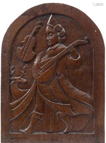 A carved oak domed panel: depicting Orpheus playing a lute, carved in low relief, 46.5cm x 34cm.