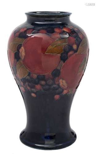 A Moorcroft baluster vase: decorated and tube lined in the Pomegranate pattern,