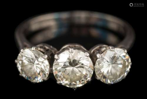 A graduated diamond three-stone ring: with round brilliant-cut diamonds estimated to weigh 0.