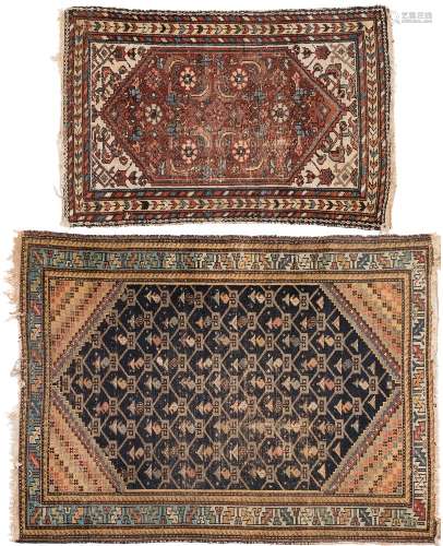 A Hamadan rug:, the indigo field with a geometric lozenge boteh design and pastel blue border,