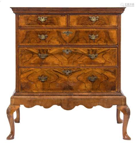 An early 18th Century walnut veneer and crossbanded chest on a later stand:,