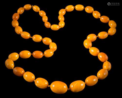 A graduated amber bead single-string necklace: comprising 42 individually knotted,