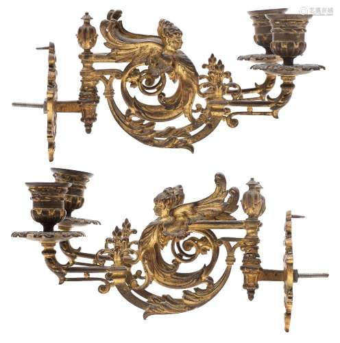 A pair of 19th century French gilt bronze twin branch wall lights: with urn -shaped nozzles on