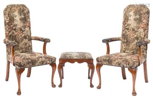 A pair of walnut open armchairs in the early 18th Century taste:, with upholstered stuff over backs,