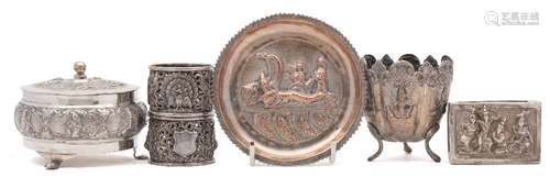 A Burmese silver bowl and cover: with embossed figural decoration, raised on three swept feet,