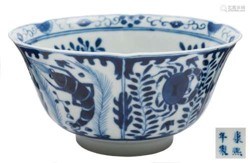 A Chinese blue and white porcelain bowl: the exterior painted with fish and crustacea,