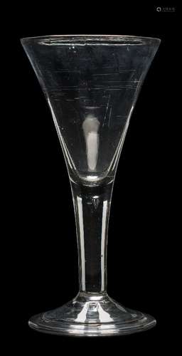 A large mid 18th century wine glass: with trumpet-shaped bowl, on air tear stem and folded foot, 26.