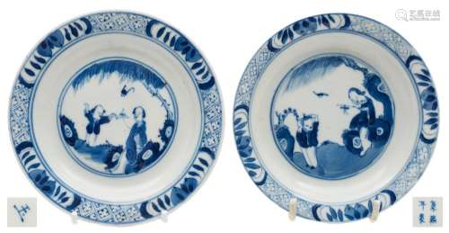 Two Chinese porcelain plates: each painted in blue with a mother and child beneath a willow tree