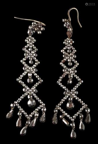 A pair of early 19th century cut-steel pendant earrings: set throughout with faceted steel studs,