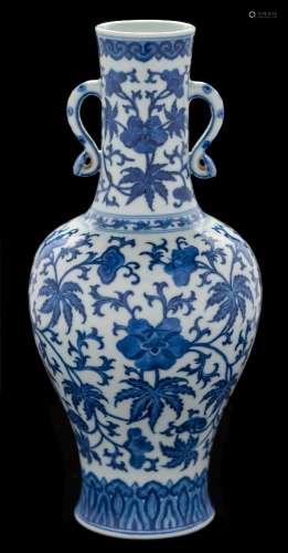 A Chinese blue and white vase: of baluster form with waisted slender neck and ruyi handles,