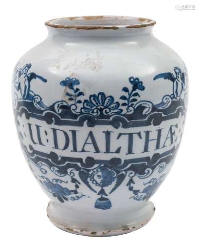 A pair of London blue and white delftware dry drug jars: each painted with an elaborate strapwork