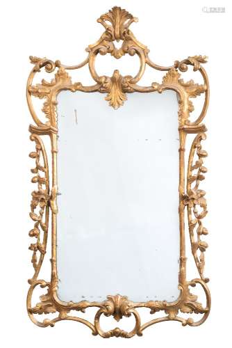 A 19th Century carved giltwood mirror:, of cartouche shaped outline, with palmette,
