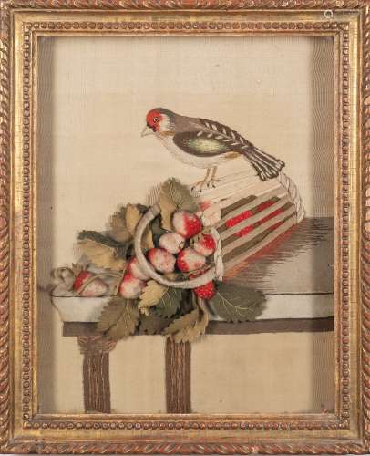 An early 19th century felt and needlework picture: depicting a chaffinch perched on an upturned