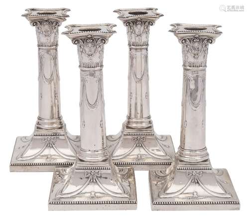 A set of four Victorian silver candlesticks, maker Thomas Bradbury & Sons, London,