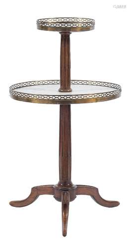 A French beechwood, white marble and brass galleried circular two tier graduated dumb waiter:,