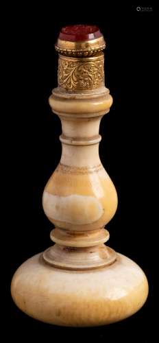 A 19th century gilt metal mounted ivory seal: with ring turned bulbous handle with oval carved