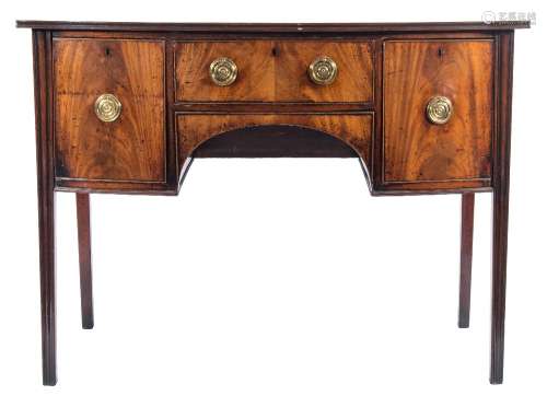 A Regency mahogany bow-fronted sideboard:, the top with a moulded edge,