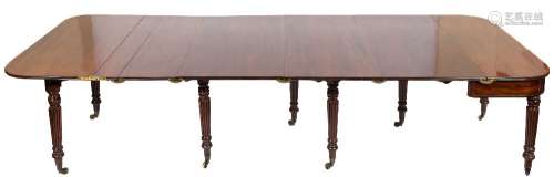 A Regency mahogany and inlaid concertina action extending dining table:,