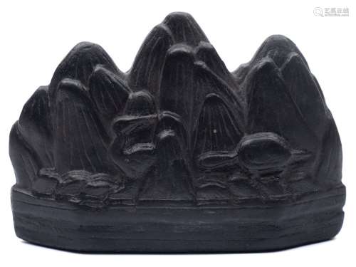 A Chinese mountain-form inkstone: in the form of three peaks with animals and birds around the base,