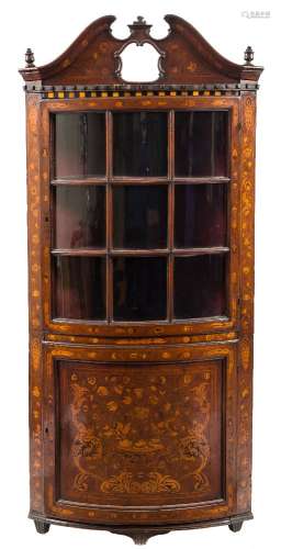 A late 18th/early 19th Century Dutch walnut and floral marquetry bow-fronted standing corner