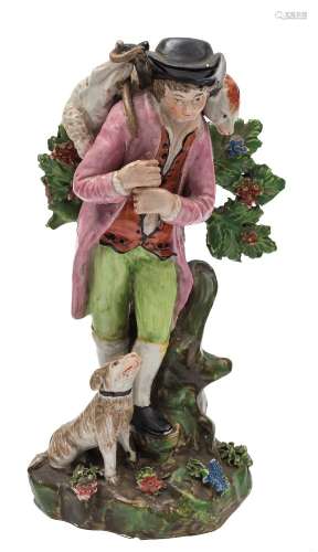 A Staffordshire pearl glazed pottery figure of 'The Lost Sheep Found': the shepherd carrying the