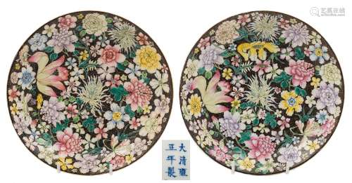 A pair of Chinese famille noire millefleur dishes: each painted with full blown flowers and foliage
