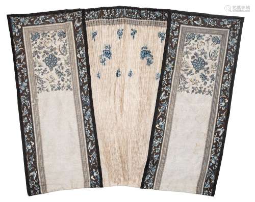 A late 19th century Chinese embroidered silk skirt: with cream and blue embroidered borders of