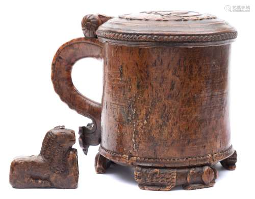 A 19th century Scandinavian lion peg tankard: the shallow domed hinged lid with carved low relief