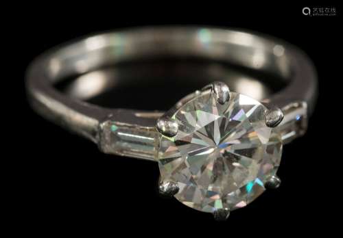 A 20th century diamond solitaire ring: the round, brilliant-cut diamond approximately 8.