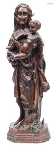 A late 19th century German carved wood Madonna and Child: raised on a stepped rectangular base with