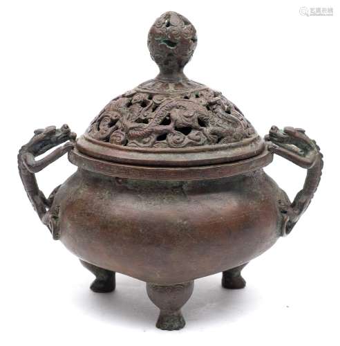 A Chinese bronze tripod 'dragon' censer and cover: of circular form with pierced cover and chilong